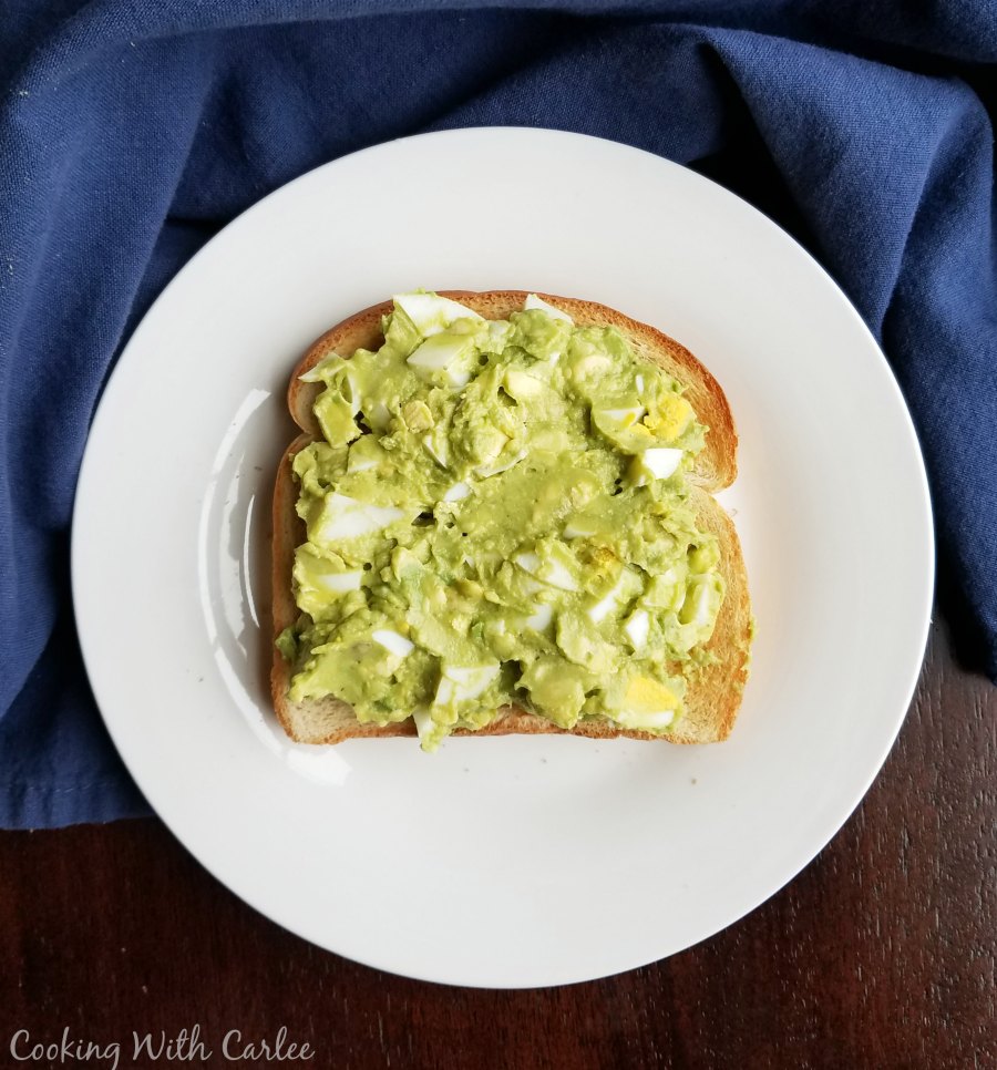 avocado egg salad spread over toast.