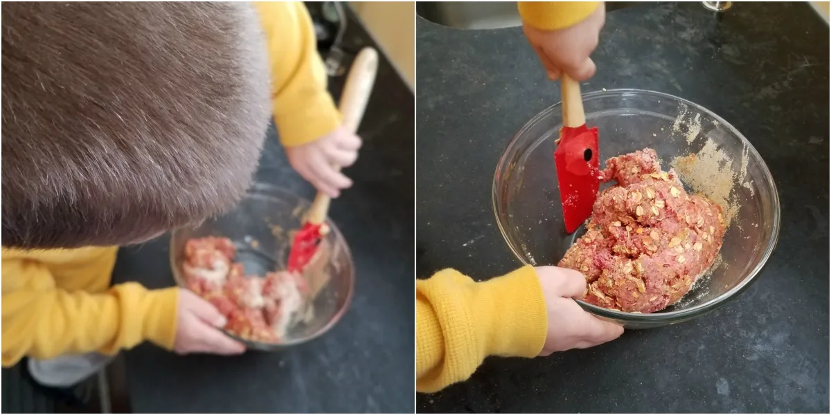 little dude mixing up meatball ingredients in a glass mixing bowl