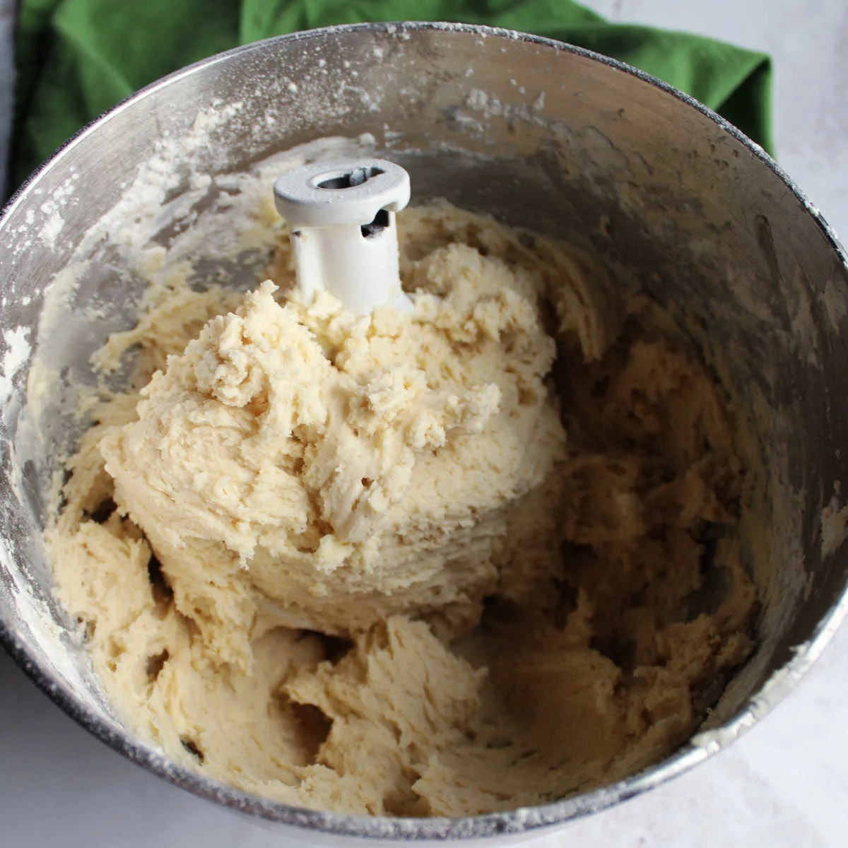 mixer bowl filled with sweetened condensed milk cookie dough.