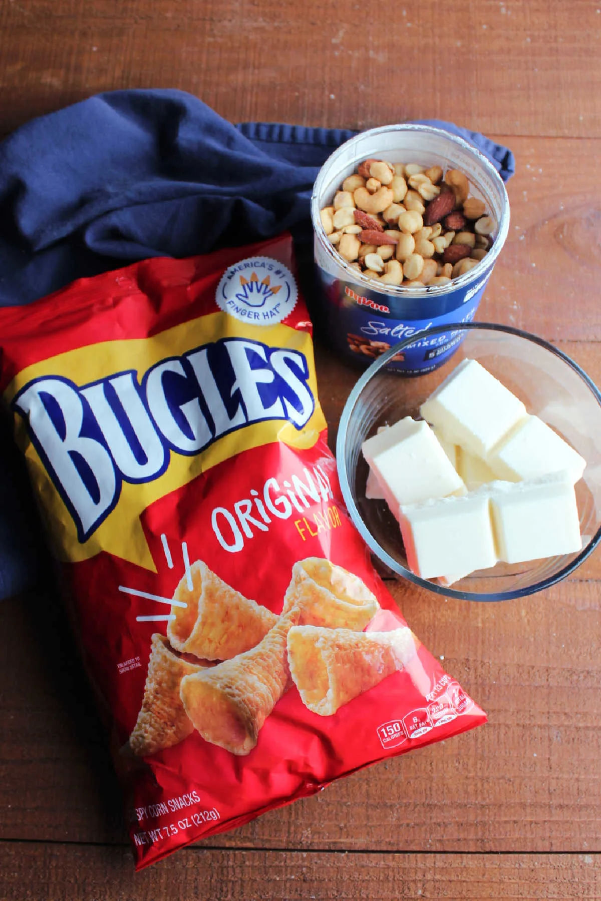 Ingredients ready to be made into white chocolate coated bugles with mixed nuts.