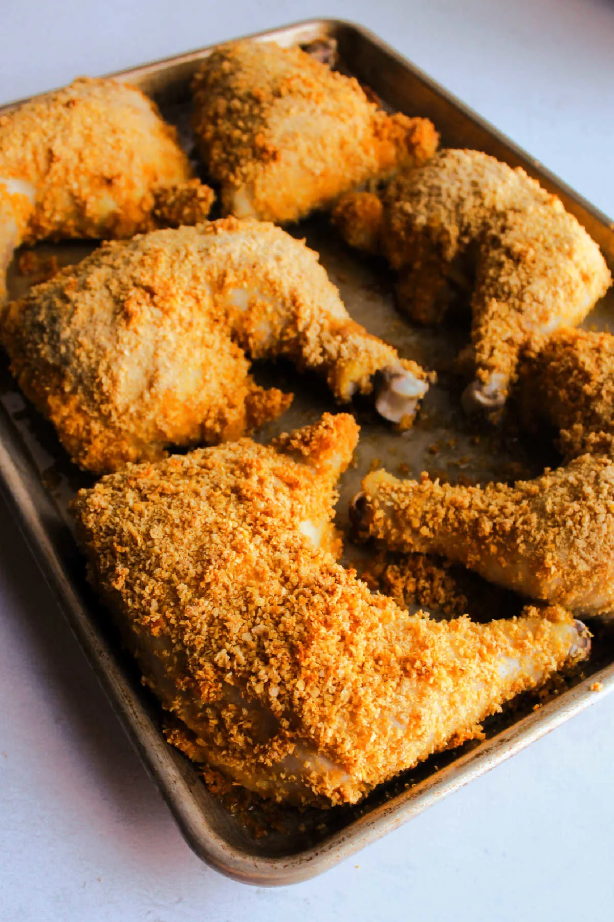 Tray of cornflake crumb coated chicken fresh from the oven. 