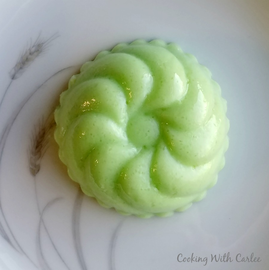 swirly creamy green jello unmolded onto a plate