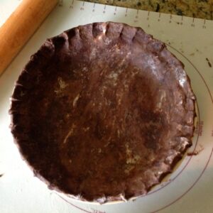 Chocolate pie crust pastry in pie plate ready for filling.