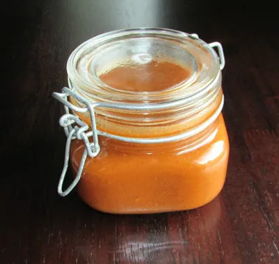 Jar of red enchilada sauce, ready to be used.