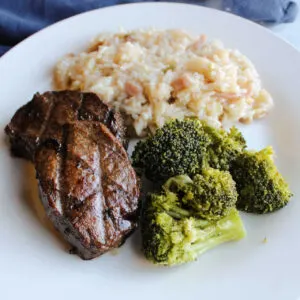 Dinner plate with grilled bul kogi style backstrap, broccoli and rice.