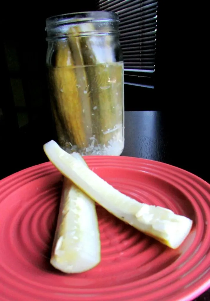 homemade pickle spears on plate ready to eat.