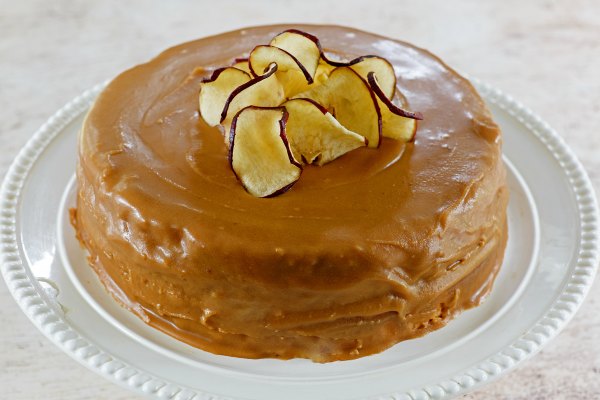 cake frosted with homemade caramel frosting and topped with apple chips.
