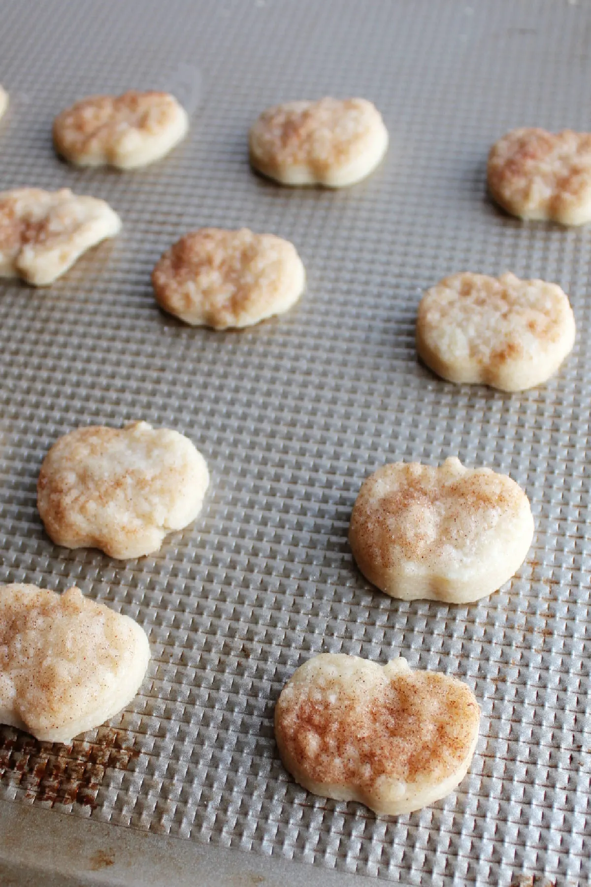 puffed up flaky pie crust cookies with cinnamon sugar on them fresh from the oven.