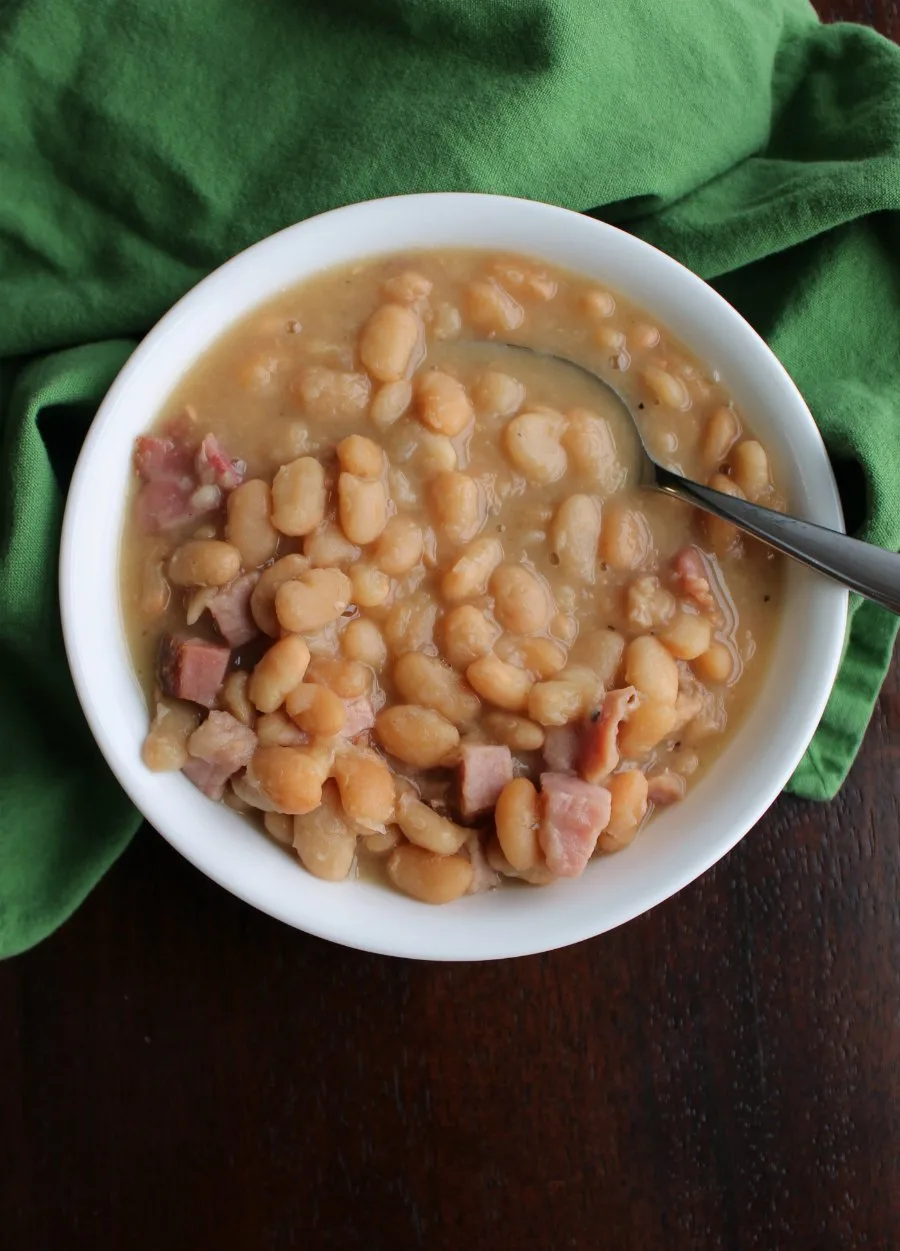bowl filled with thick ham and beans ready to eat.