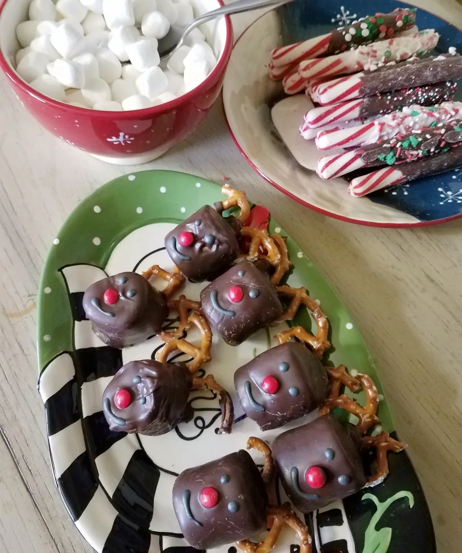 Rudolph marshmallows as part of a hot chocolate bar with mini marshmallows and chocolate dipped peppermint sticks.