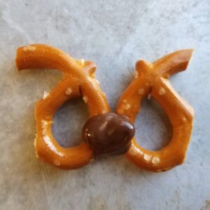 Chocolate Dipped Rudolph Marshmallows 9 two pretzel halves joined together with a little bit of melted chocolate ready to be rudolph's antlers.