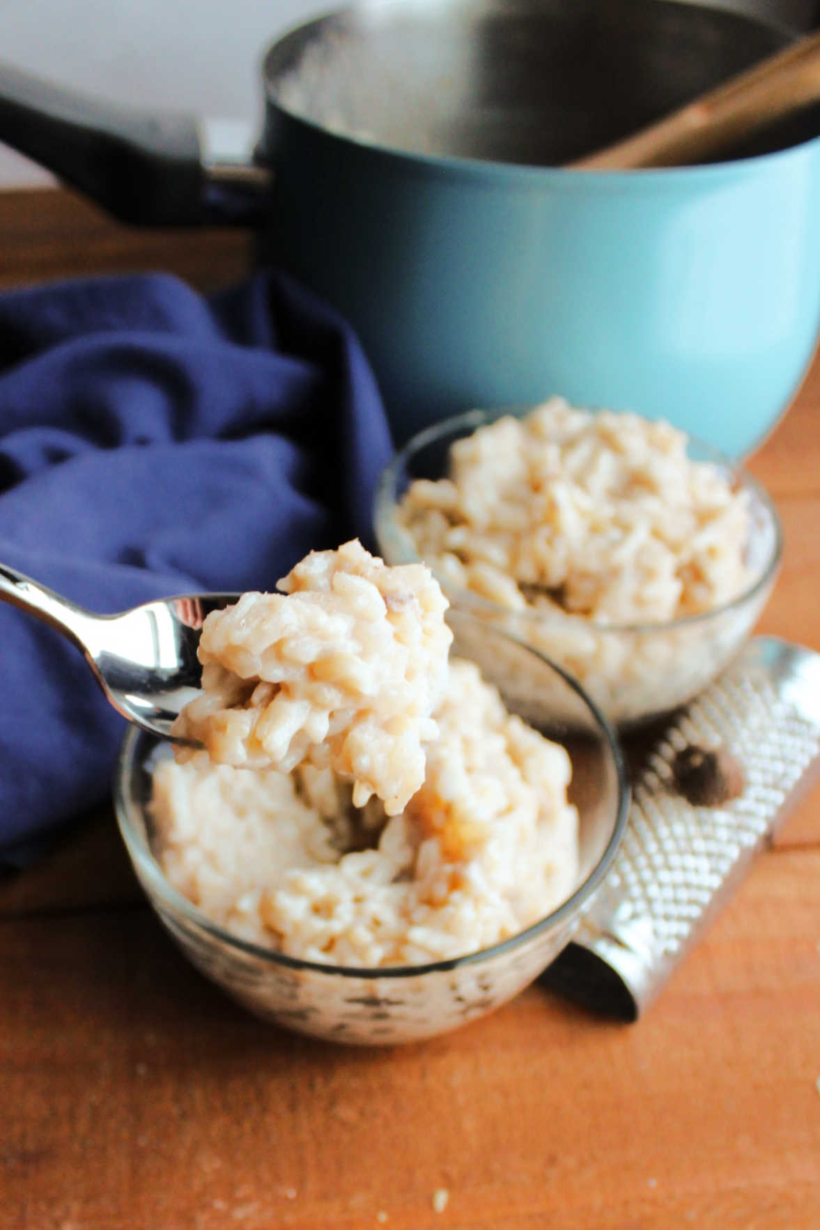spoonful of creamy banana rice pudding ready to be eaten.