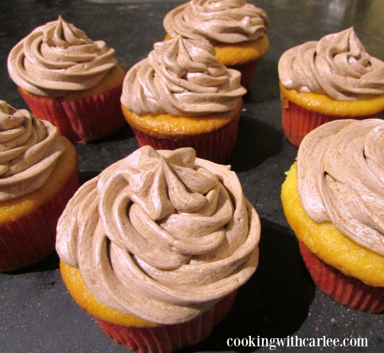 Cupcakes topped with swirls of soft chocolate and coffee frosting. 