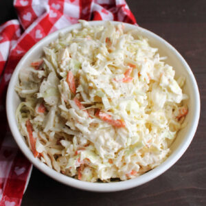 Close up of bowl filled with creamy coleslaw.