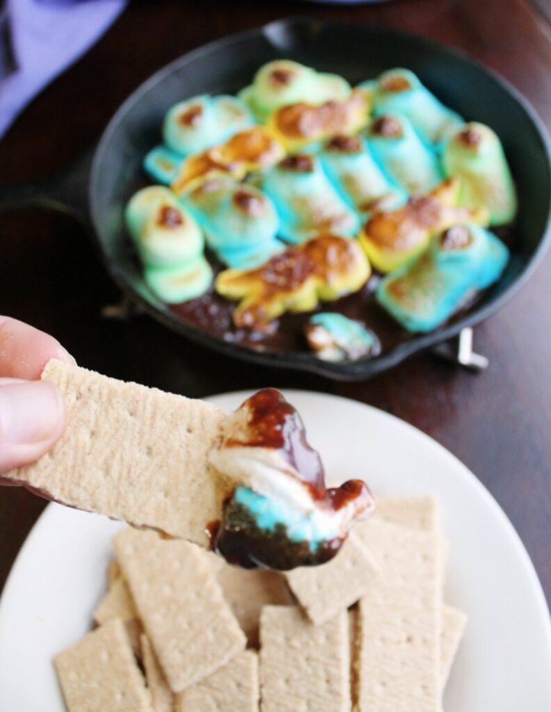 graham cracker with melted peeps and chocolate on the end.