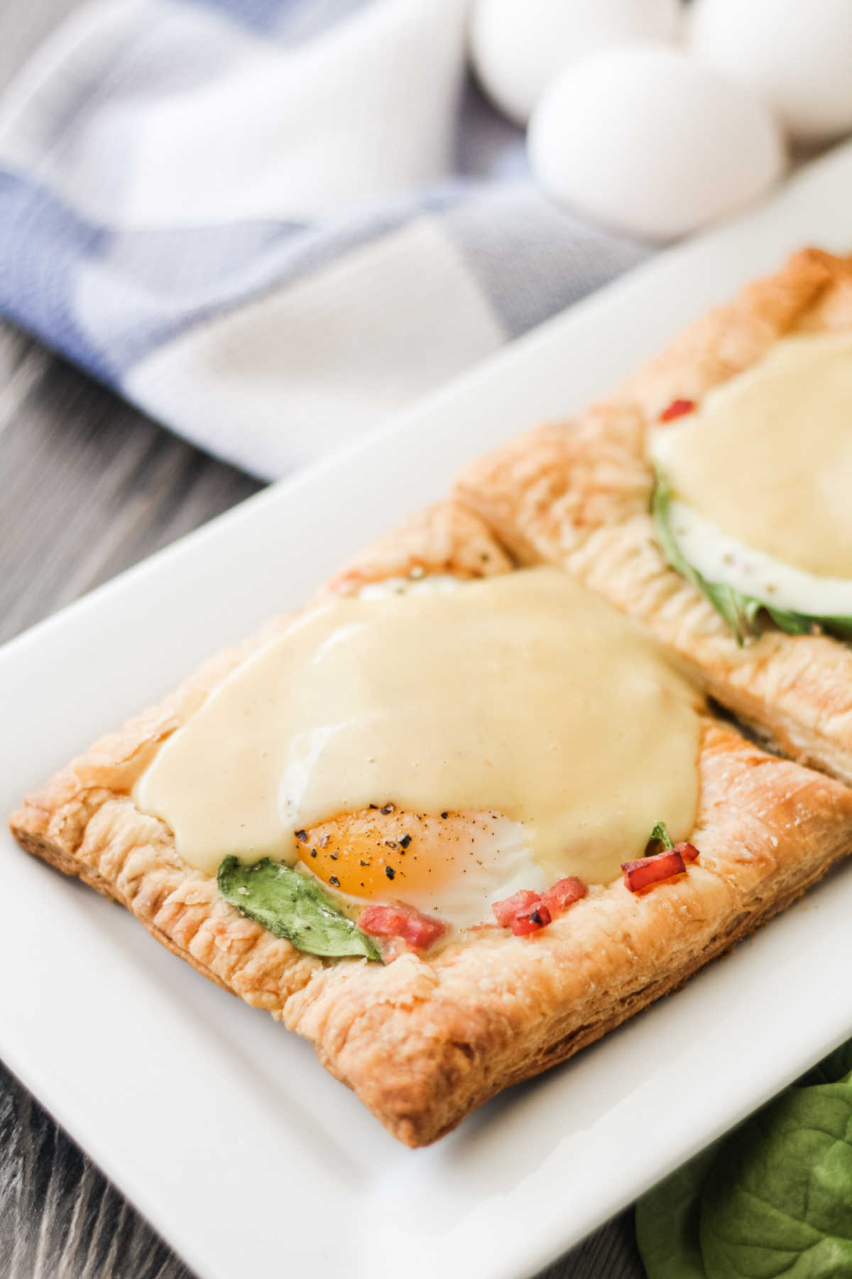 Puff pastry topped with ham, spinach, egg and hollandaise sauce.