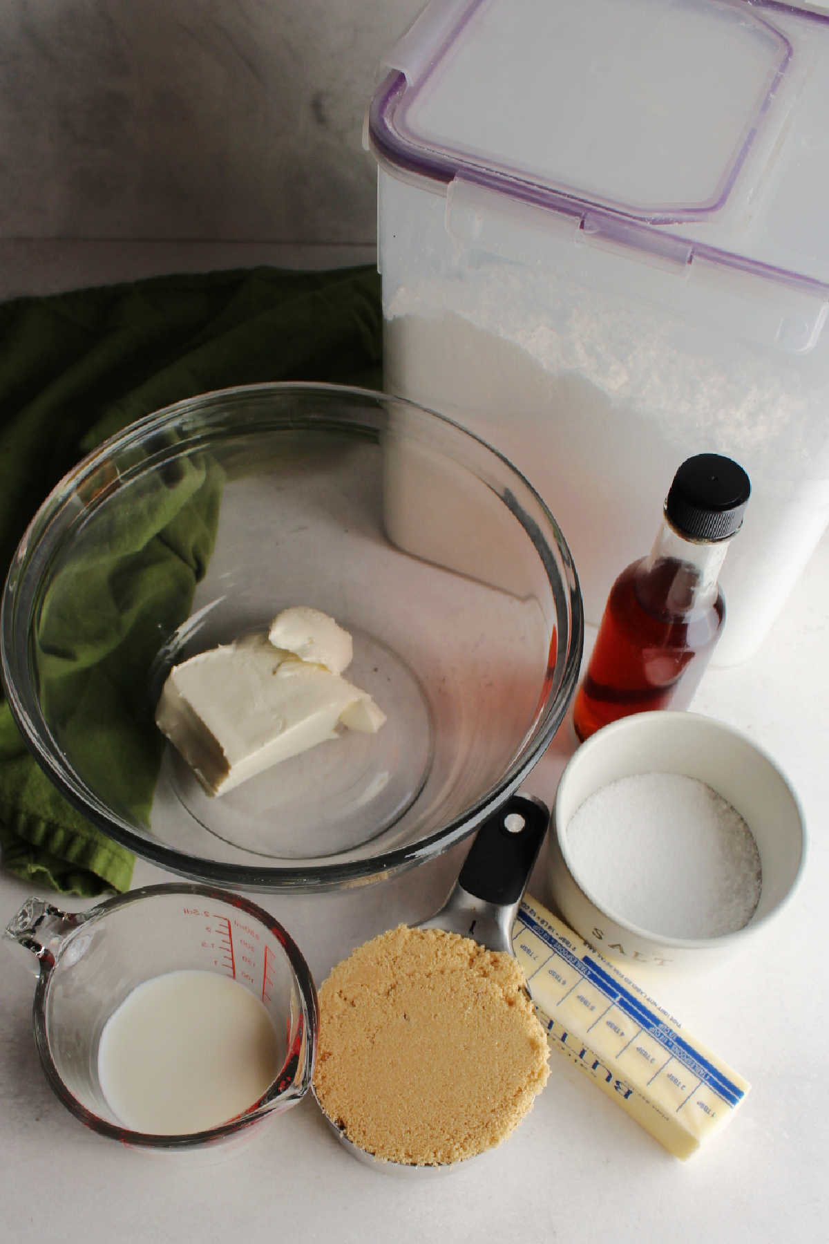 Ingredients: cream cheese, milk, brown sugar, butter, vanilla, salt and confectioners sugar ready to be made into icing.