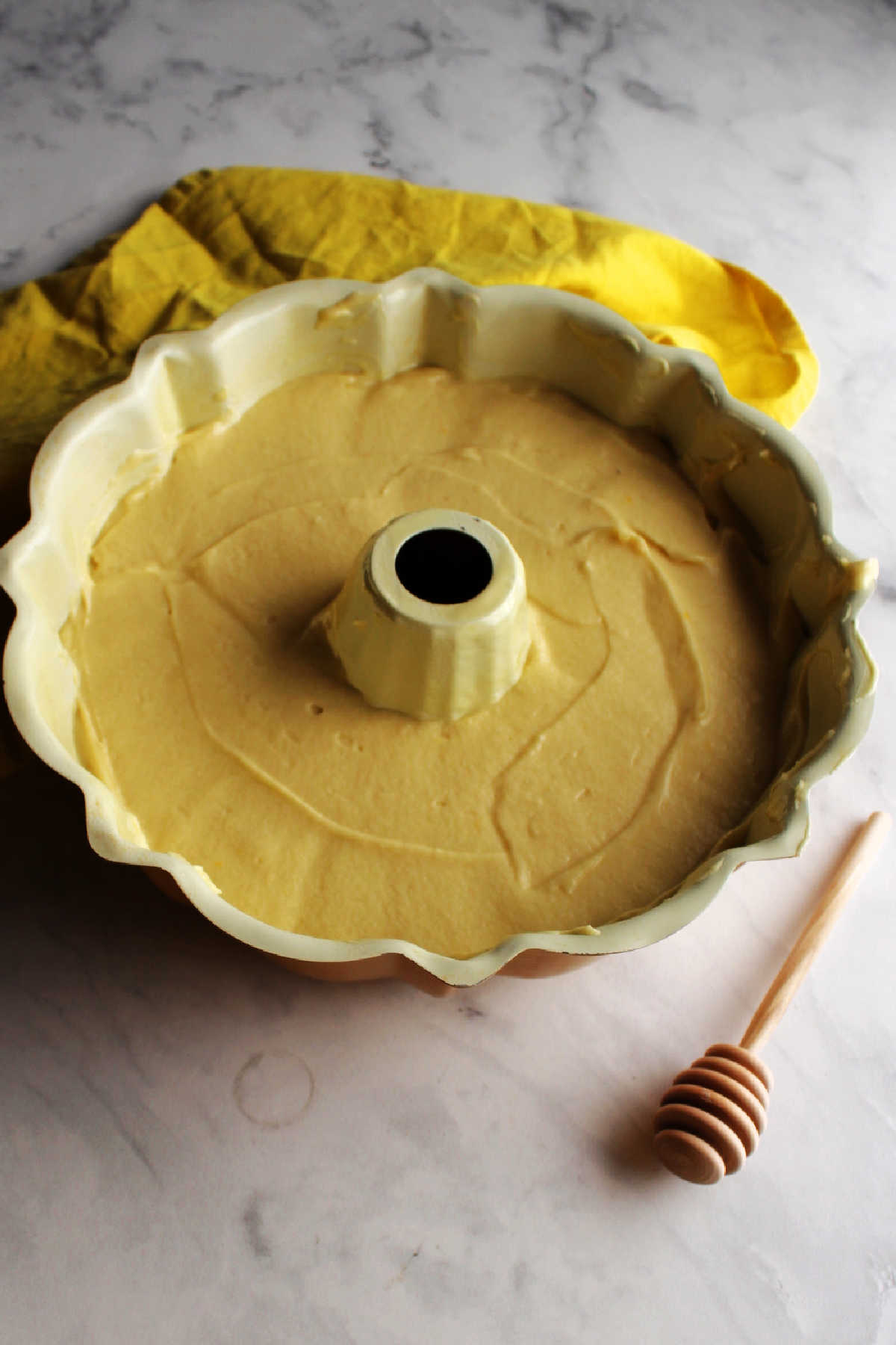 Honey lemon cake batter in bundt pan ready to bake.