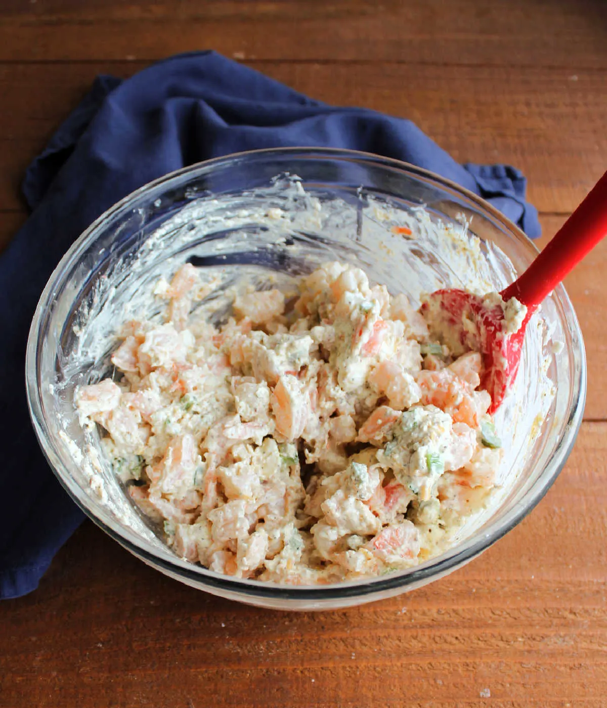 Mixing bowl of cajun shrimp dip showing the high ratio of shrimp to cream cheese mixture.