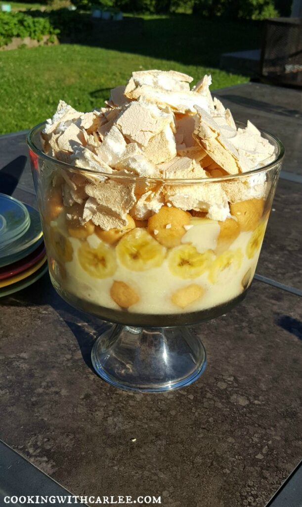 Trifle bowl filled with homemade banana pudding topped with shards of meringue.