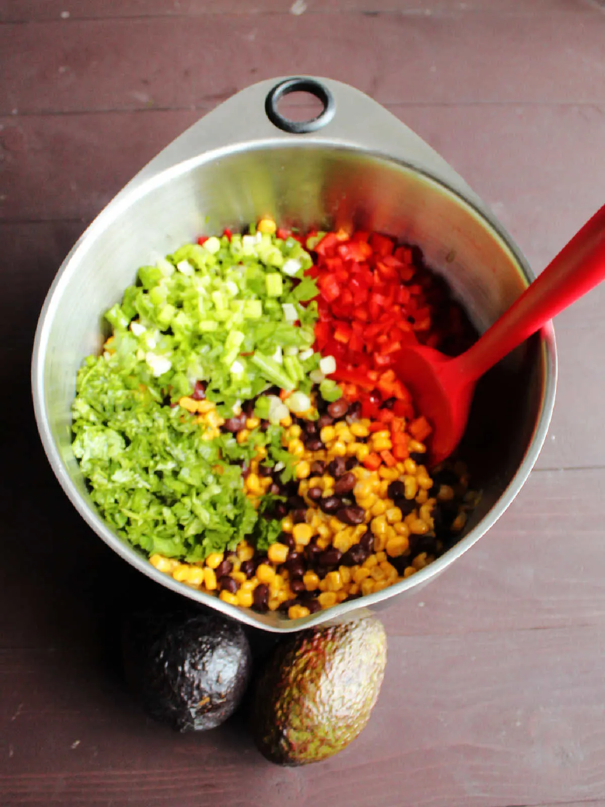 stirring red pepper, cilantro and green onions into black bean and corn mixture.