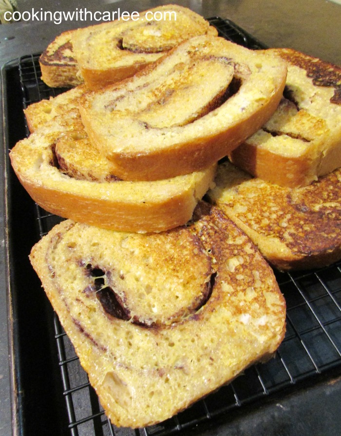 Slices of cinnamon swirl sourdough bread made into french toast.