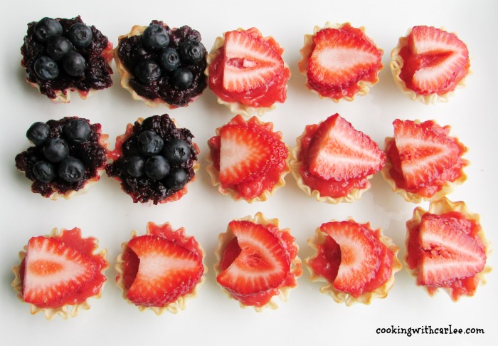 strawberry and blueberry mini tarts in the shape of an American flag.