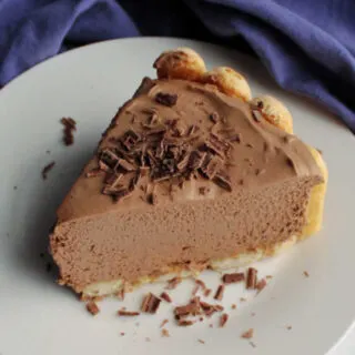 slice of mocha cheesecake with lady finger crust