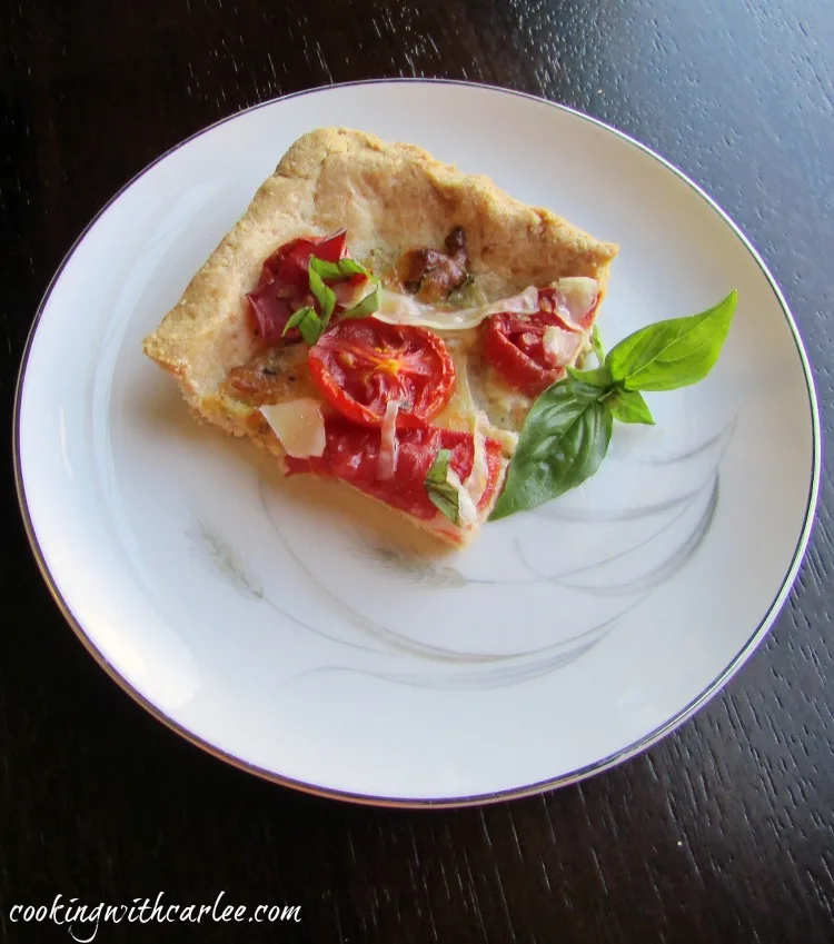 piece of tomato slab pie with fresh basil