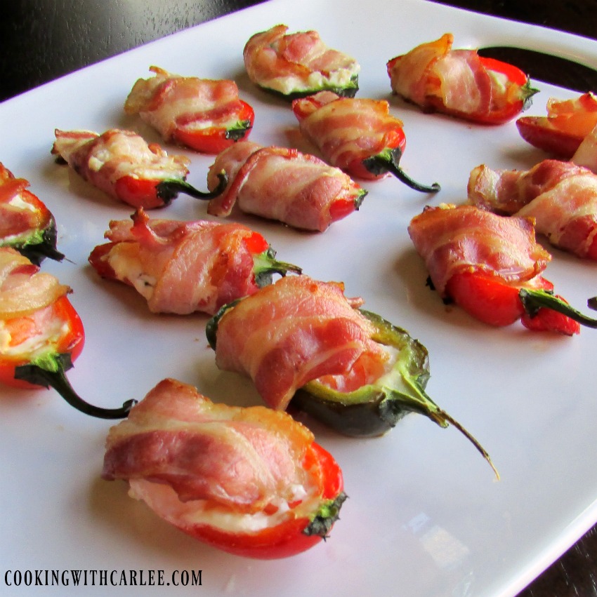 platter of jalapenos stuffed with cream cheese, shrimp and wrapped in bacon