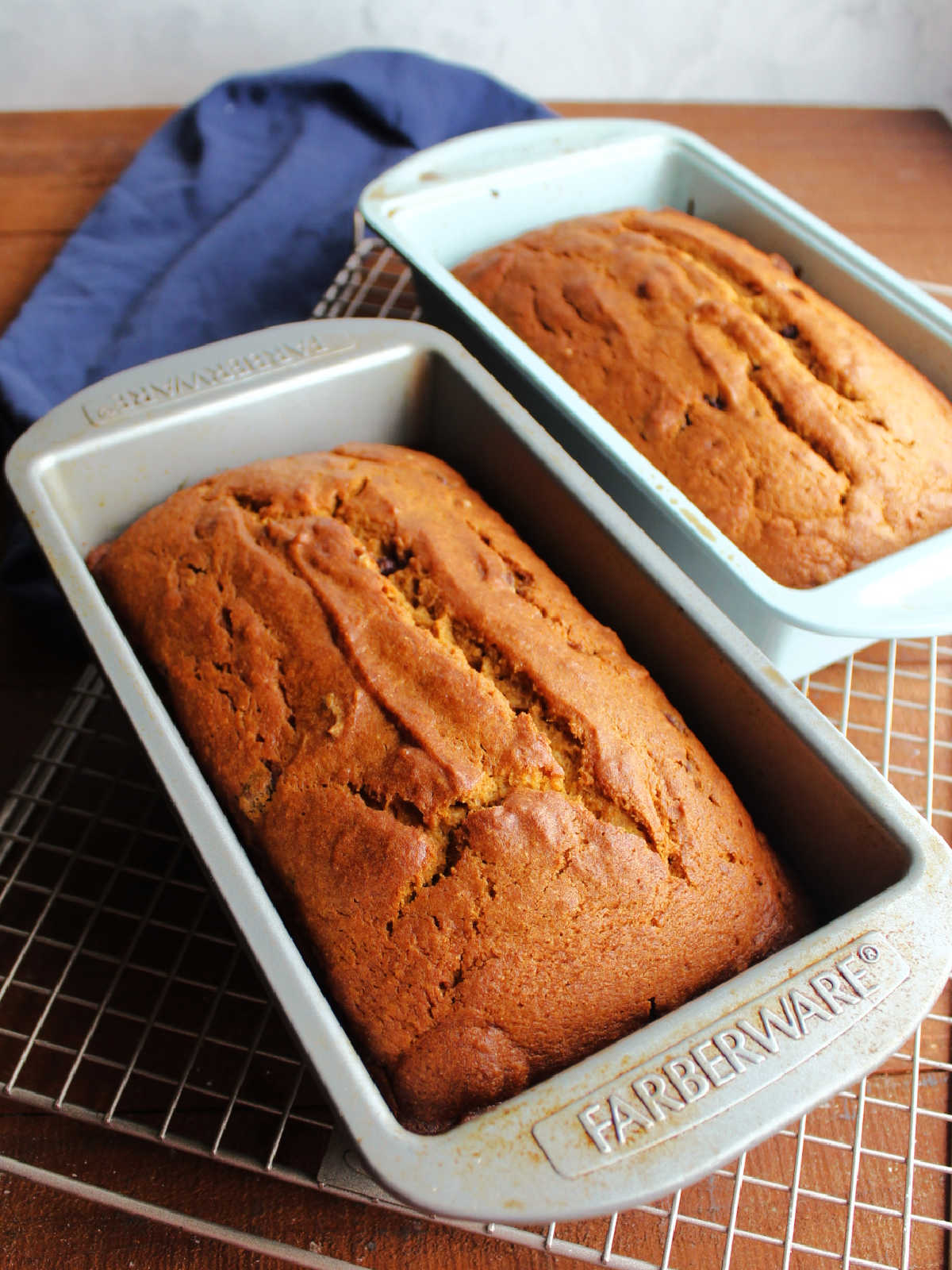 Freshly baked loaves of pumpkin bread with chocolate chips.