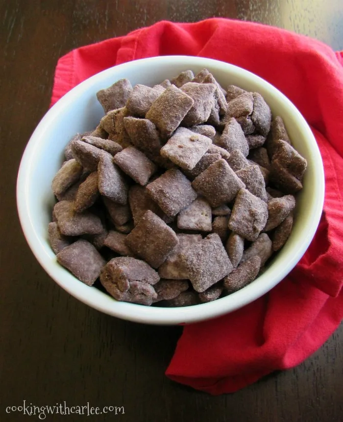bowl of chocolate and peanut butter brownie batter puppy chow ready for snacking.
