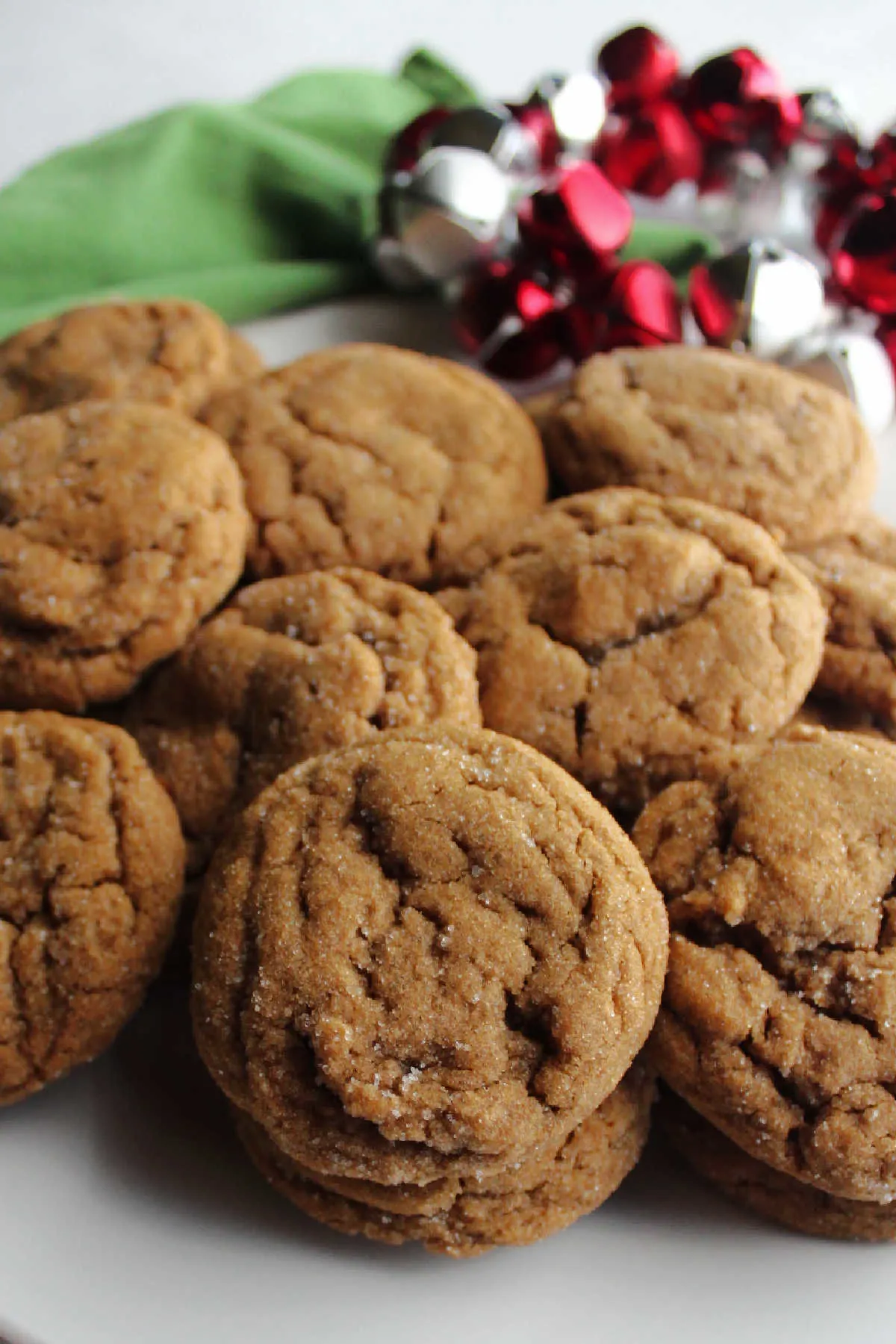 Plate of sugar coated crinkled molasses cookies ready to be served.