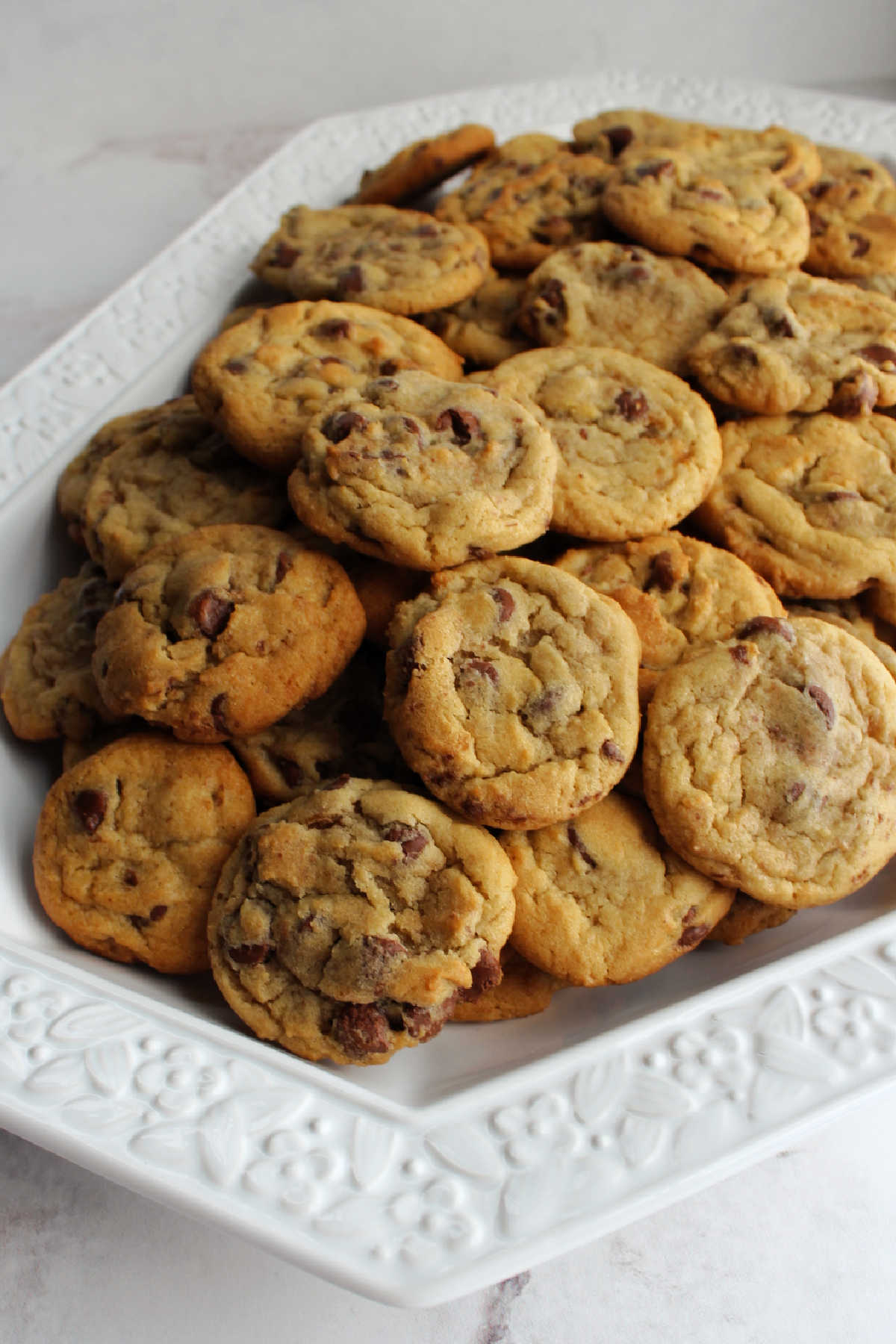 platter filled with chocolate chip cookies.