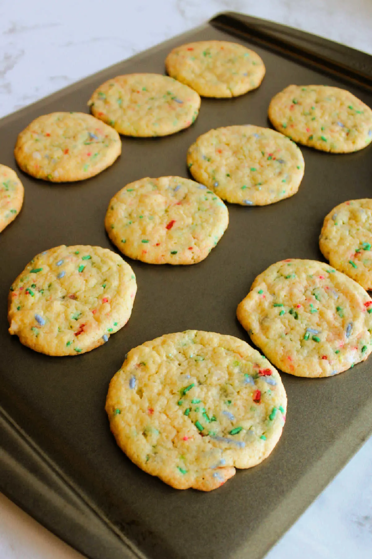 Tray of freshly baked sprinkle filled vanilla cake mix cookies