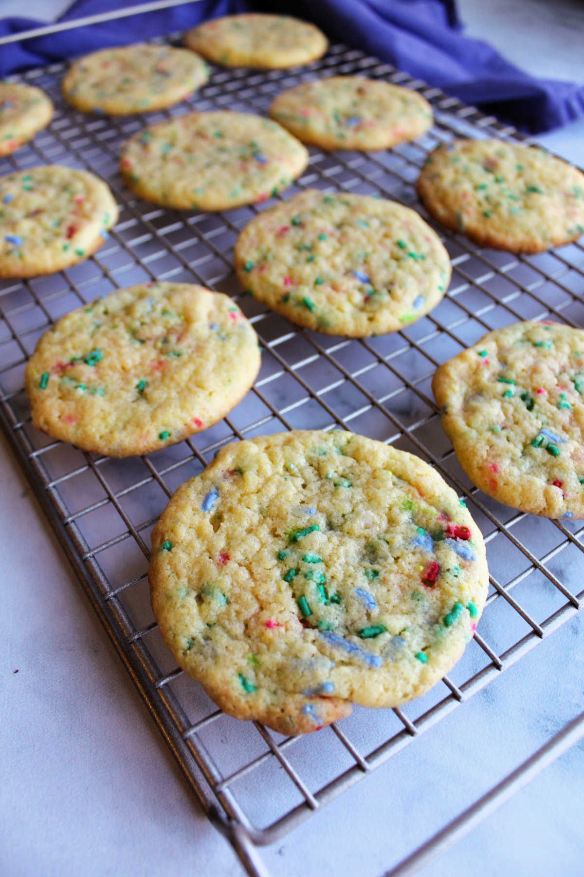 sprinkle filled cake mix cookies on wire cooling rack.