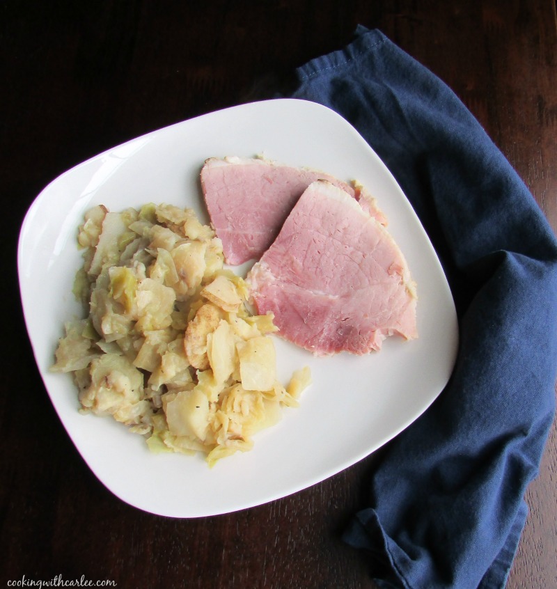plate with ham and sautéed cabbage with potatoes.