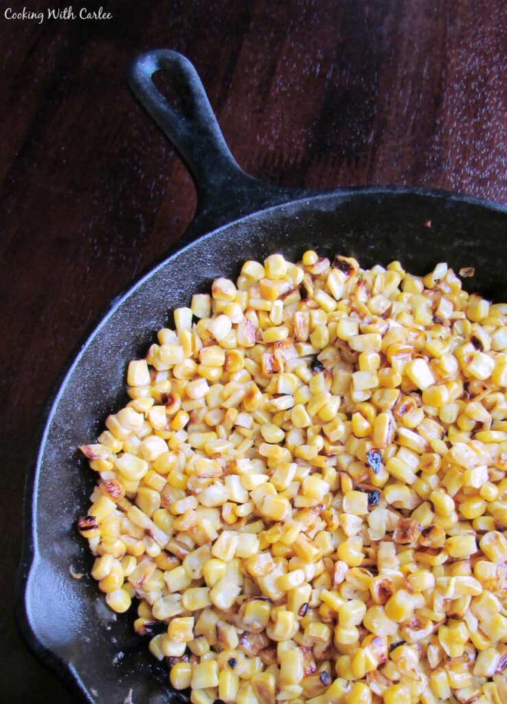 cast iron skillet with blistered corn.