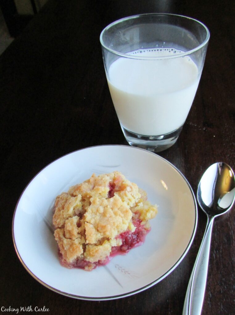 serving of rhubarb crunch and a glass of milk.