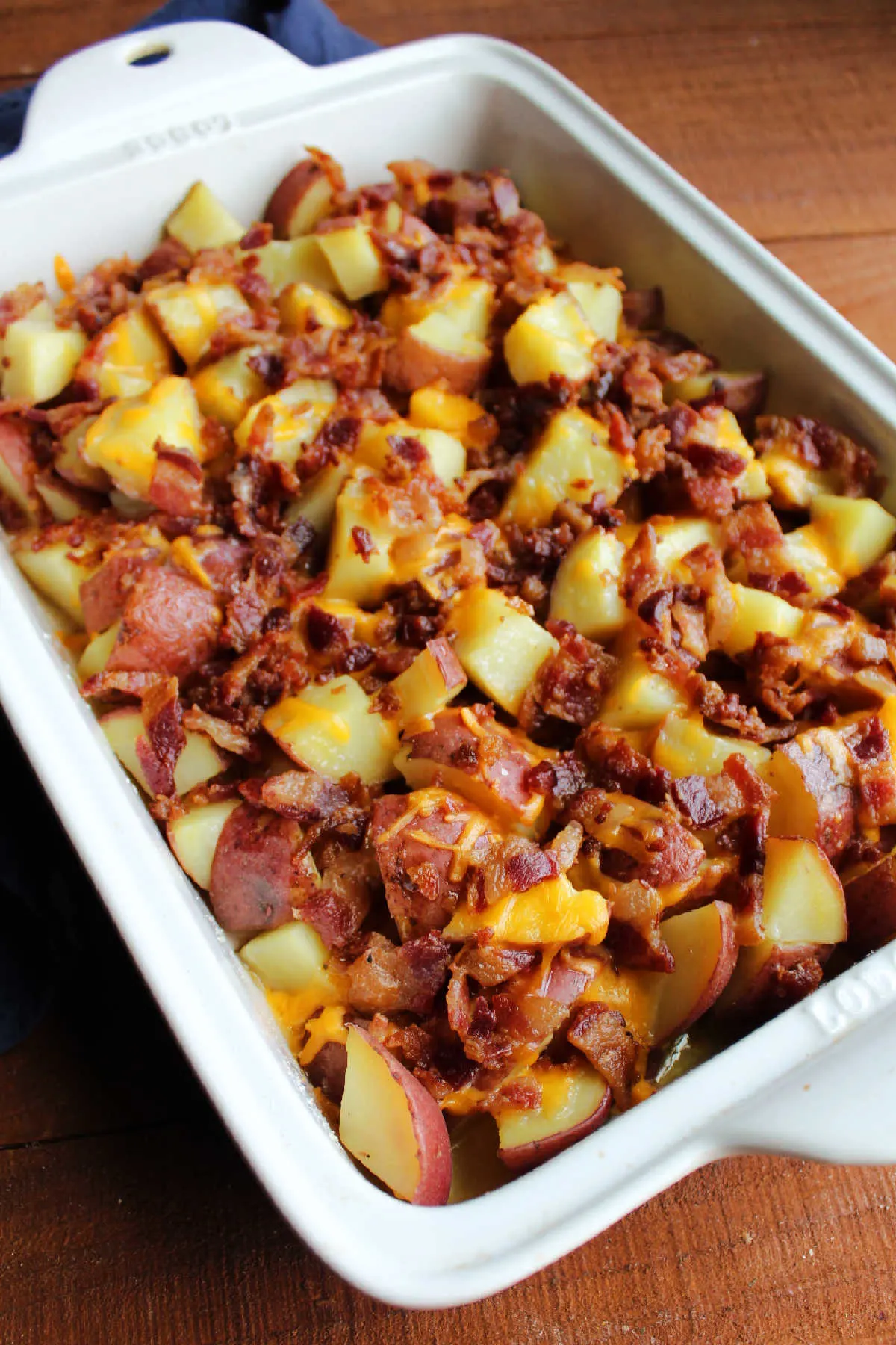 casserole dish loaded with potato chunks, cheese and bacon baked to perfection.