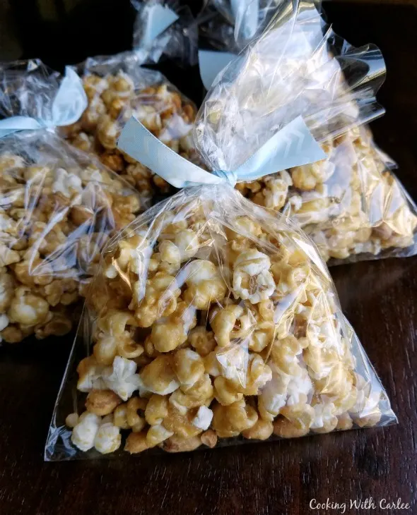 cellophane bags filled with caramel corn and tied with ribbon.