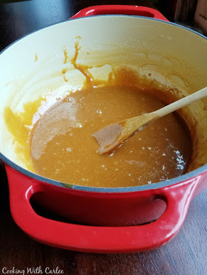 thick syrupy caramel cajaeta in a large enameled cast iron pot