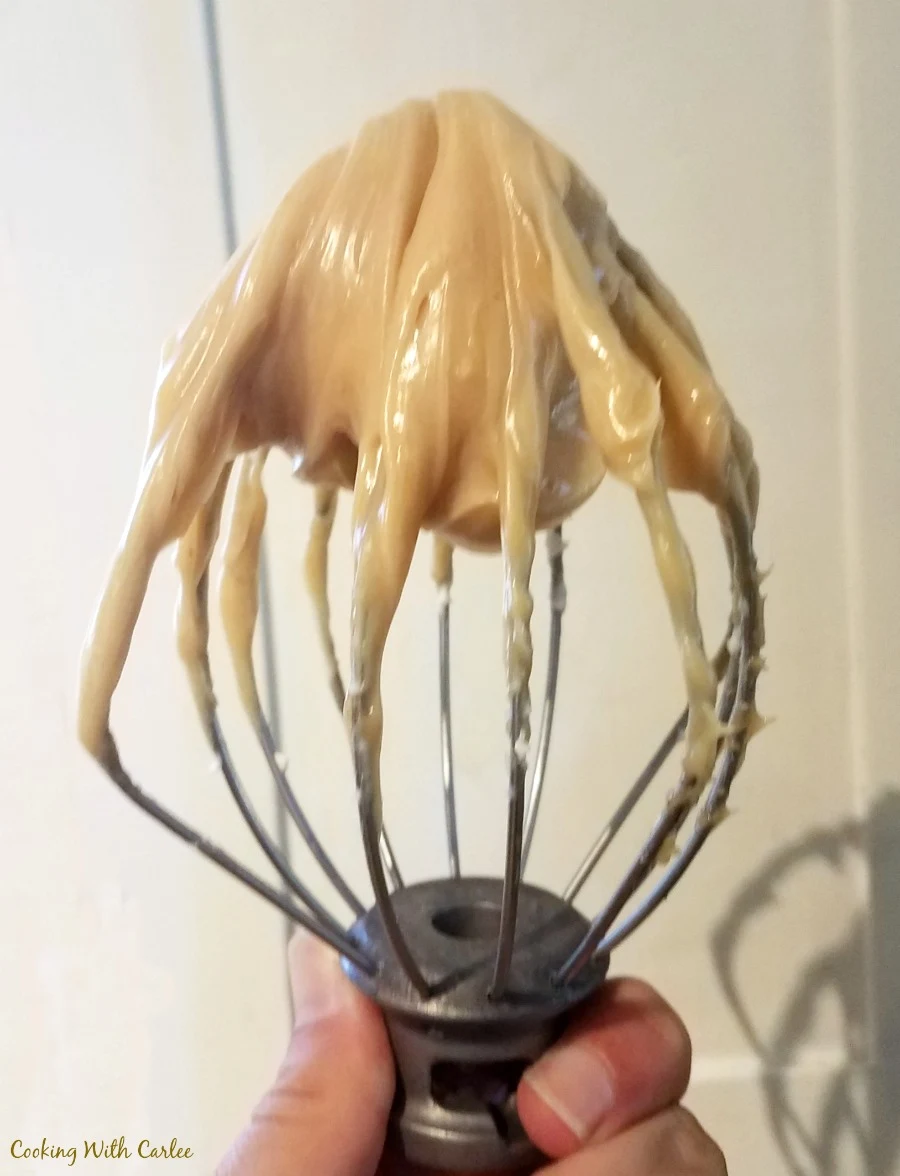 caramel frosting on a mixer beater