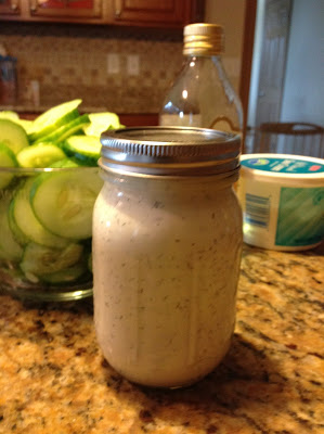 ball jar filled with sour cream and dill dressing