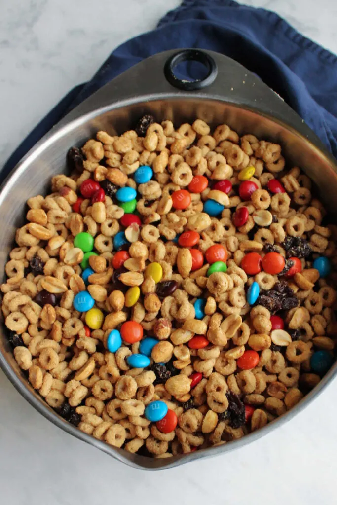 Giant storage bowl filled with trail mix style cereal snack mix.