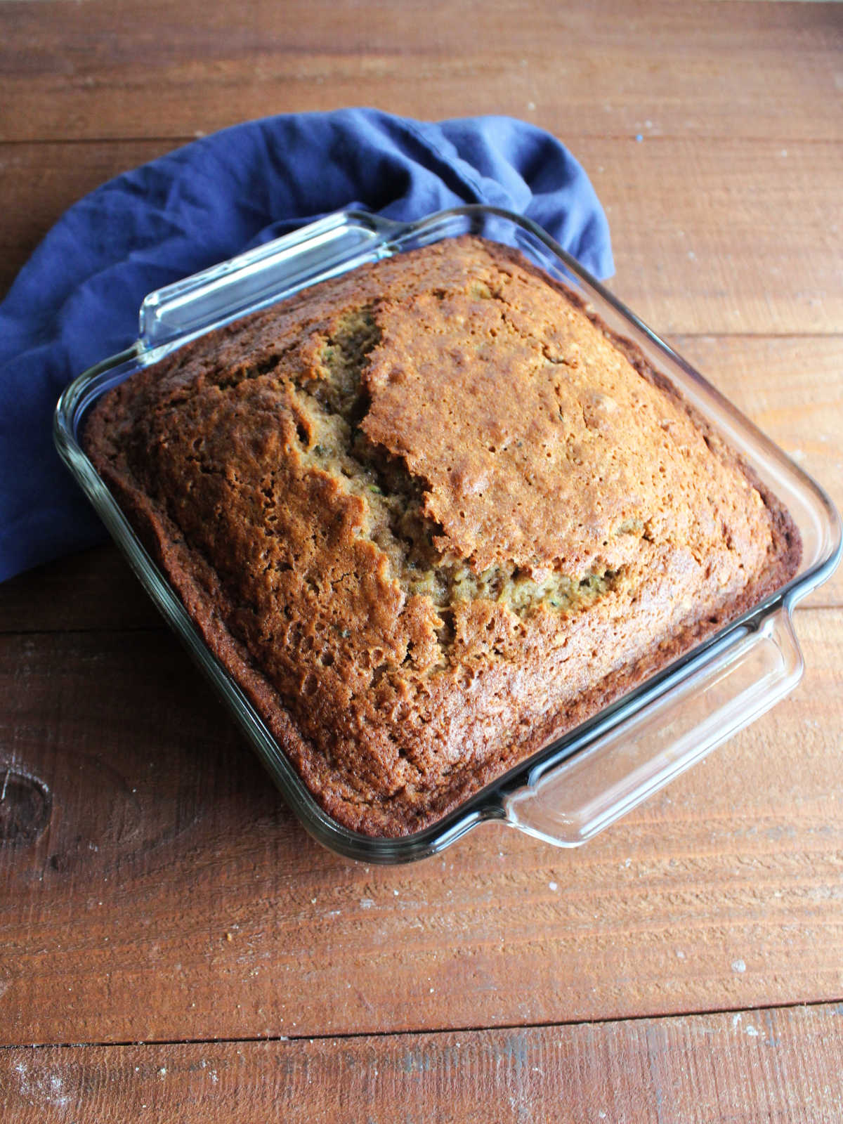 Baked zucchini bread in square baking dish, fresh from the oven. 