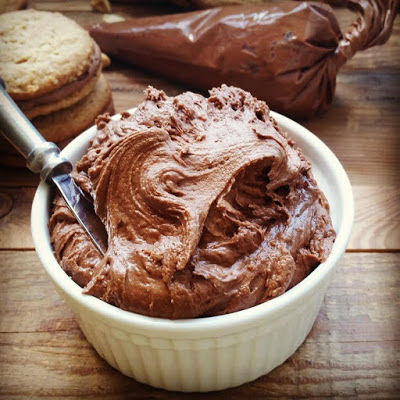 ramekin of rich chocolate and peanut butter frosting