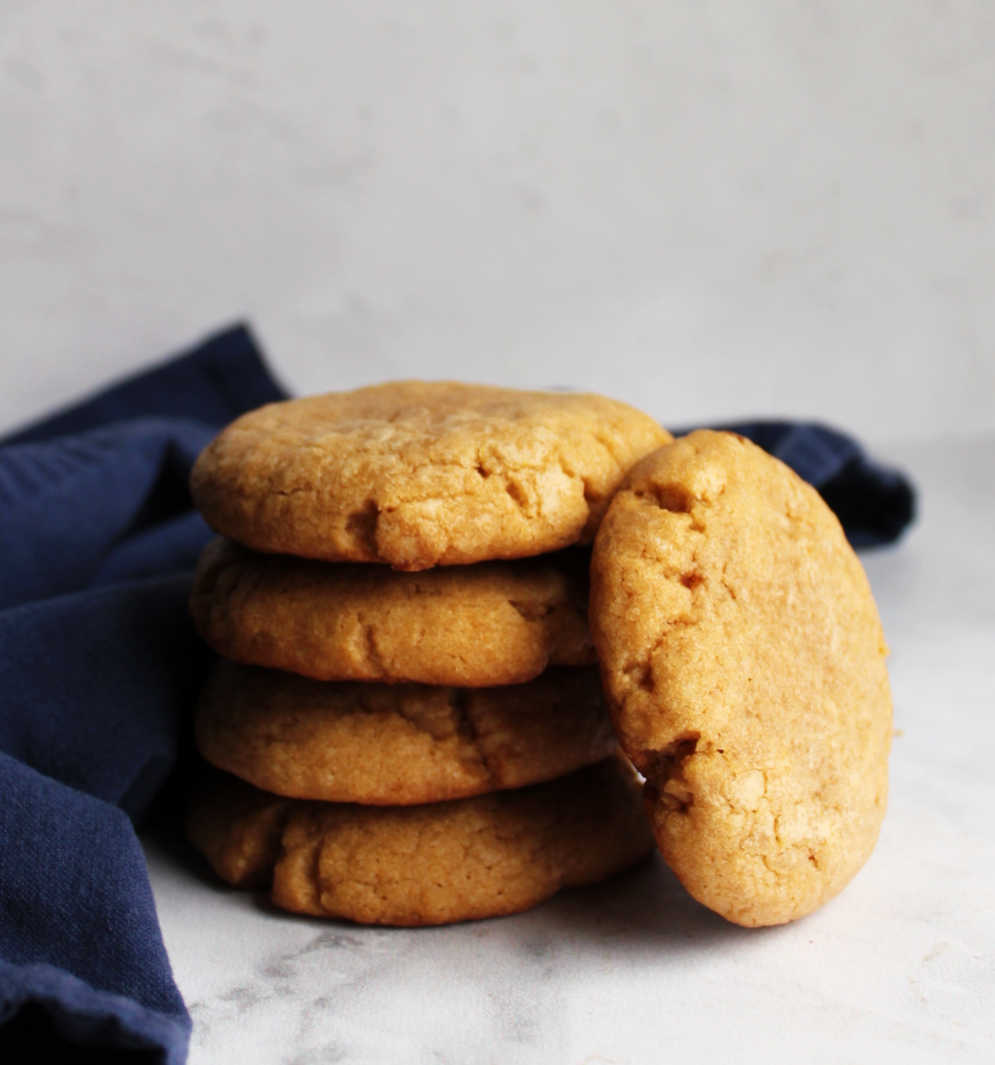 Stack of thick chewy maple cinnamon cookies.