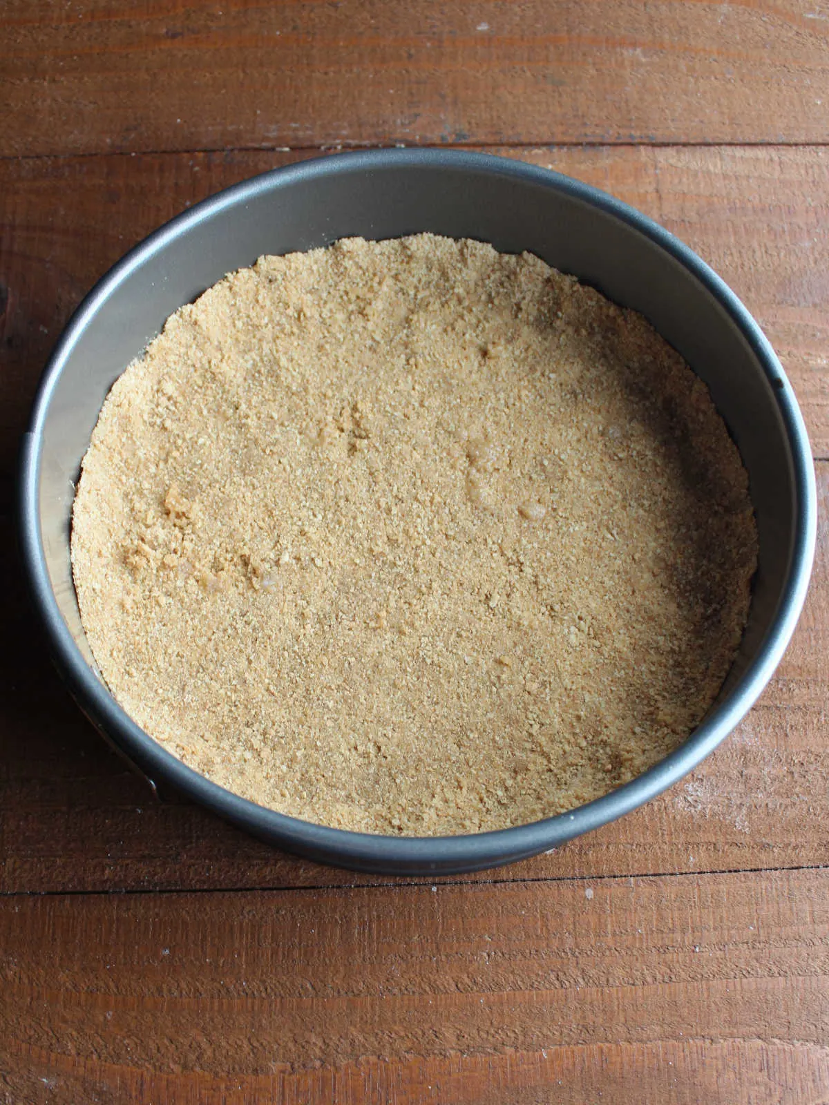Grahame cracker crust pressed into the bottom of springform pan.