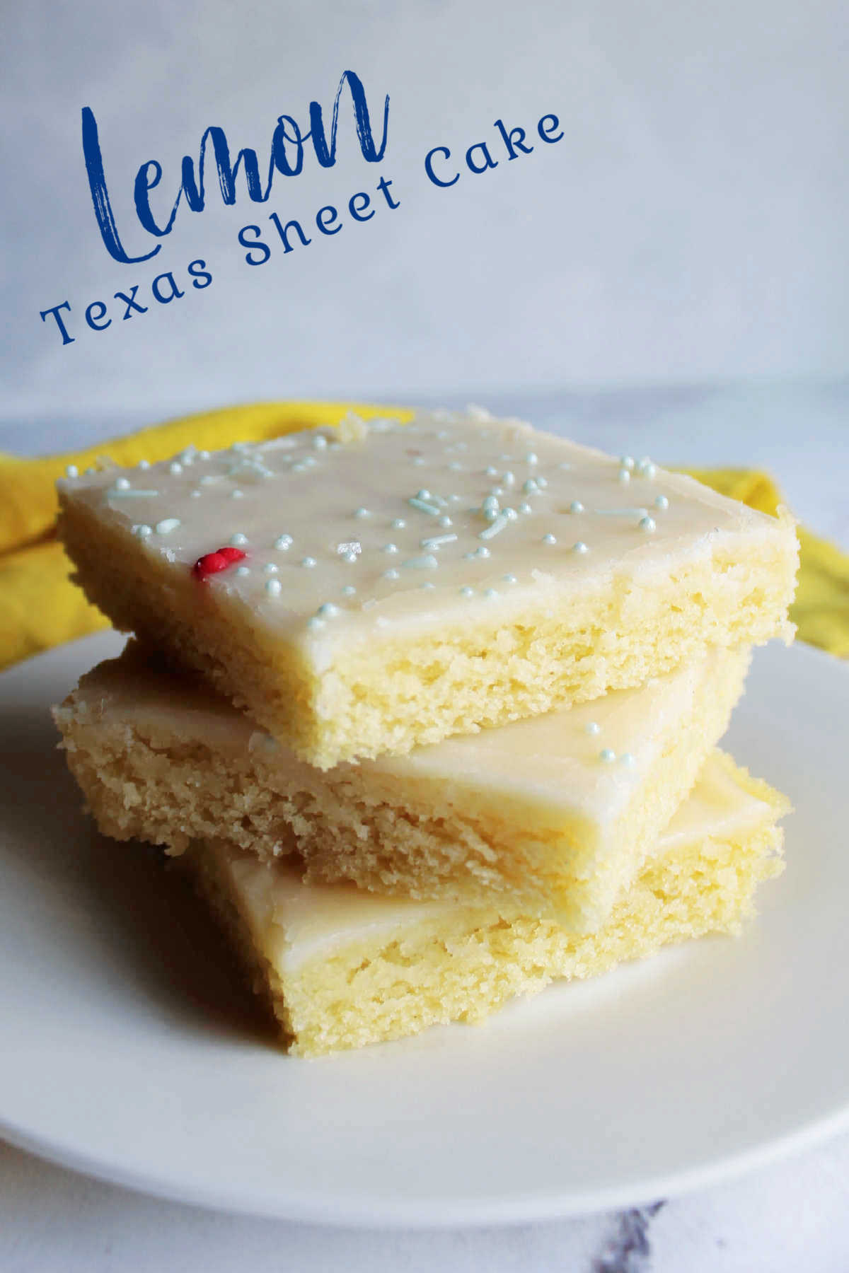 Lemon Texas sheet cake is perfect for feeding a tasty dessert to a crowd.  It is so easy to make and has just the right amount of lemon flavor. Take it to your next BBQ, family reunion or potluck!